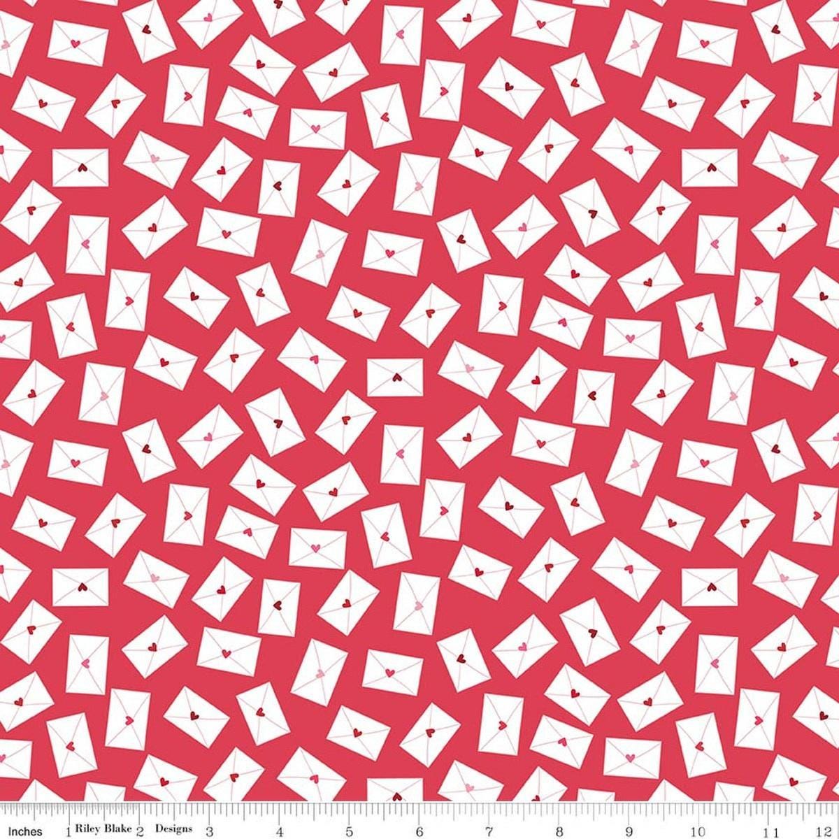 Image of Seasonal Basics Love Notes Red quilting cotton fabric by Christopher Thompson for Riley Blake Designs. Features envelopes on a red background. Cute Little Fabric Shop.