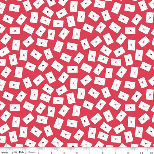Image of Seasonal Basics Love Notes Red quilting cotton fabric by Christopher Thompson for Riley Blake Designs. Features envelopes on a red background. Cute Little Fabric Shop.