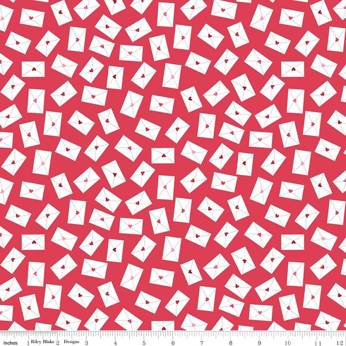 Image of Seasonal Basics Love Notes Red quilting cotton fabric by Christopher Thompson for Riley Blake Designs. Features envelopes on a red background. Cute Little Fabric Shop.