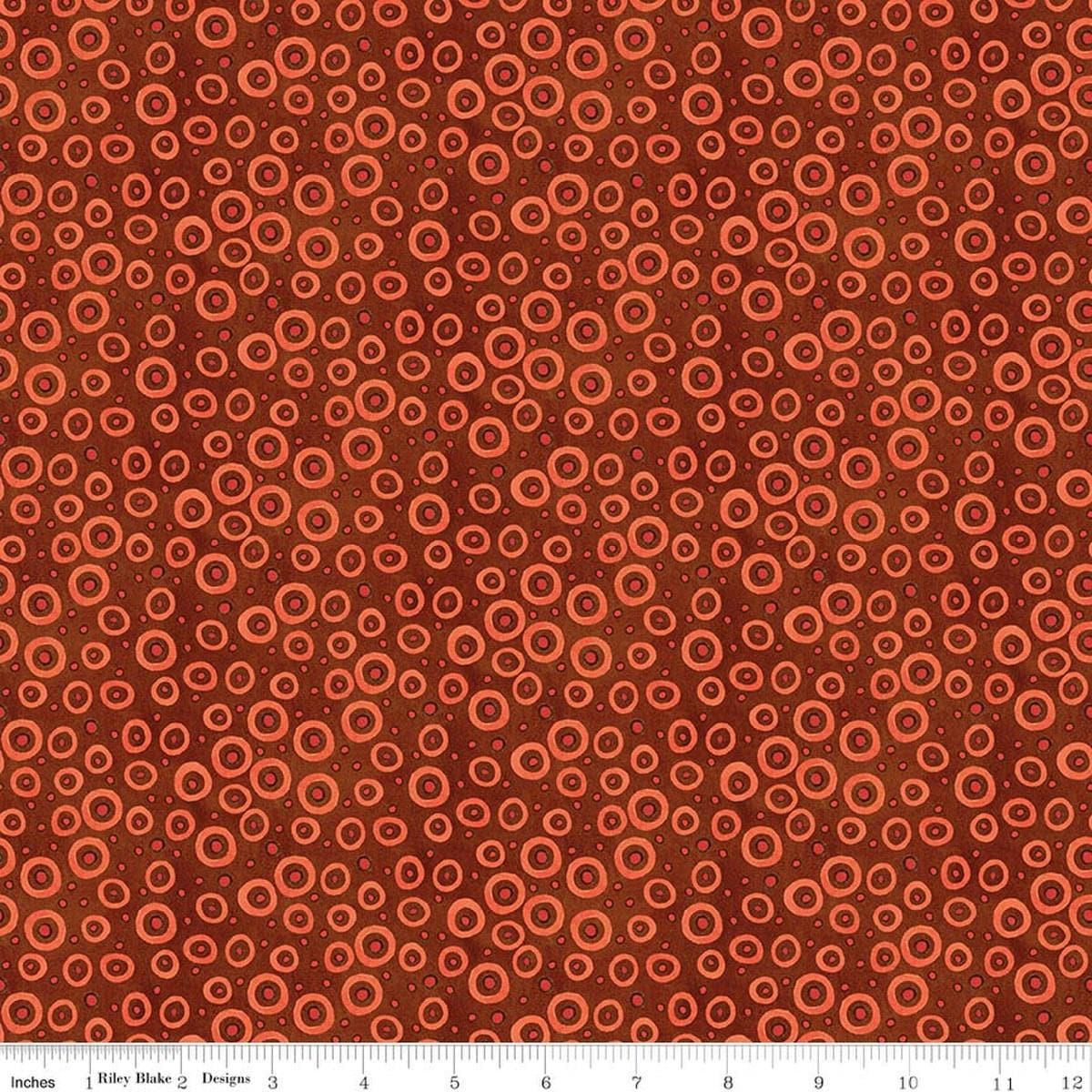 Image of Spooky Polka Dots Rusty Oak quilting cotton fabric by Teresa Kogut for Riley Blake Designs. Features dots on an orange background. Cute Little Fabric Shop.