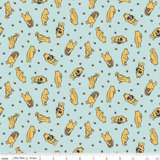 Image of Designer Flannel Winnie the Pooh Toss Blue by Echo Park Paper Co for Riley Blake Designs. Features bears on a blue background. Cute Little Fabric Shop.