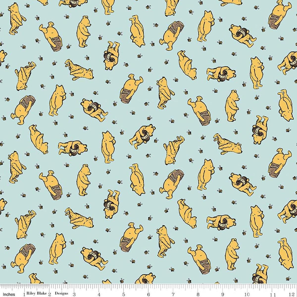 Image of Designer Flannel Winnie the Pooh Toss Blue by Echo Park Paper Co for Riley Blake Designs. Features bears on a blue background. Cute Little Fabric Shop.