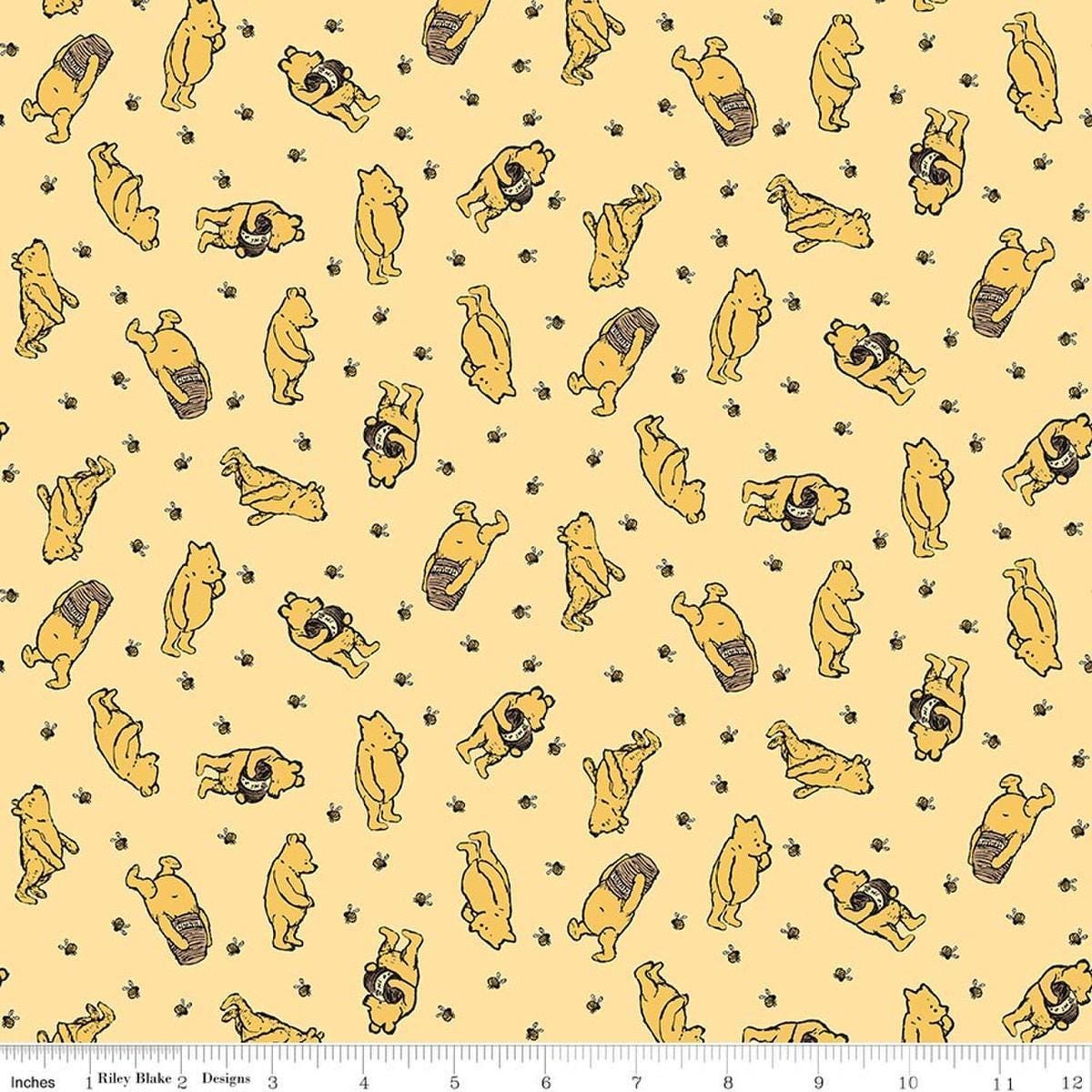 Image of Designer Flannel Winnie the Pooh Toss Sunshine by Echo Park Paper Co for Riley Blake Designs. Features bears on a yellow background. Cute Little Fabric Shop.