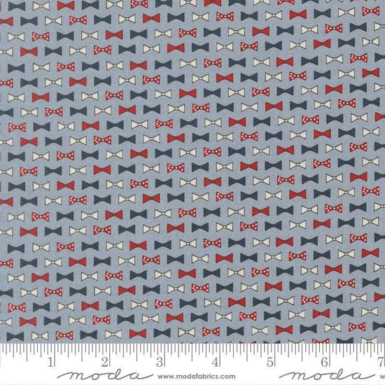 Independence Day Bowties Splash quilting cotton fabric by Sweetwater for Moda Fabrics. Features bowties on a blue background. Cute Little Fabric Shop.
