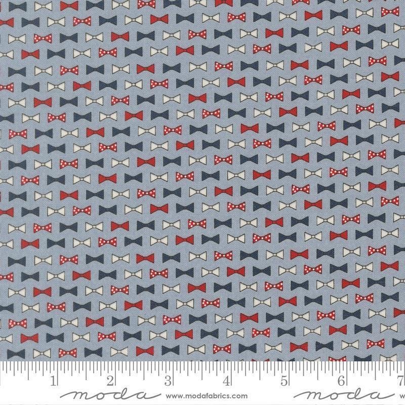 Independence Day Bowties Splash quilting cotton fabric by Sweetwater for Moda Fabrics. Features bowties on a blue background. Cute Little Fabric Shop.