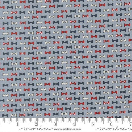 Independence Day Bowties Splash quilting cotton fabric by Sweetwater for Moda Fabrics. Features bowties on a blue background. Cute Little Fabric Shop.