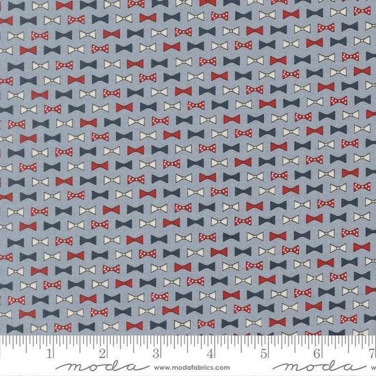 Independence Day Bowties Splash quilting cotton fabric by Sweetwater for Moda Fabrics. Features bowties on a blue background. Cute Little Fabric Shop.