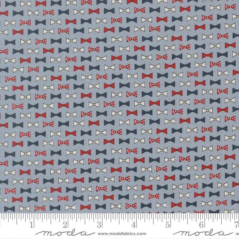 Independence Day Bowties Splash quilting cotton fabric by Sweetwater for Moda Fabrics. Features bowties on a blue background. Cute Little Fabric Shop.