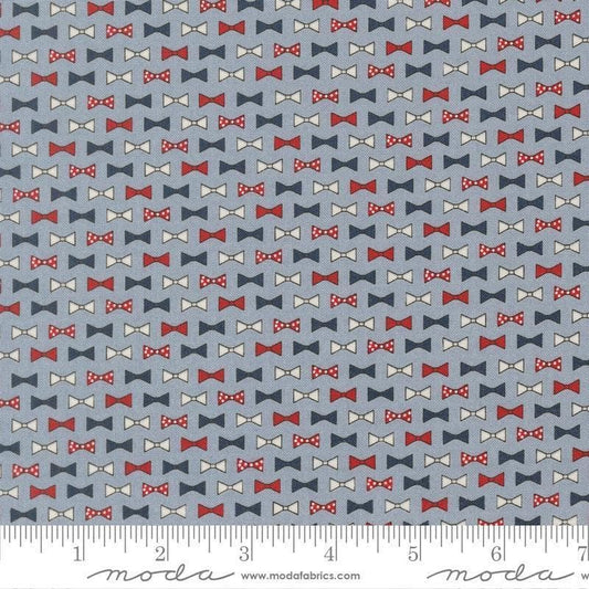 Independence Day Bowties Splash quilting cotton fabric by Sweetwater for Moda Fabrics. Features bowties on a blue background. Cute Little Fabric Shop.