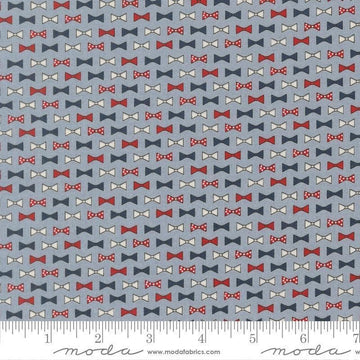 Independence Day Bowties Splash quilting cotton fabric by Sweetwater for Moda Fabrics. Features bowties on a blue background. Cute Little Fabric Shop.