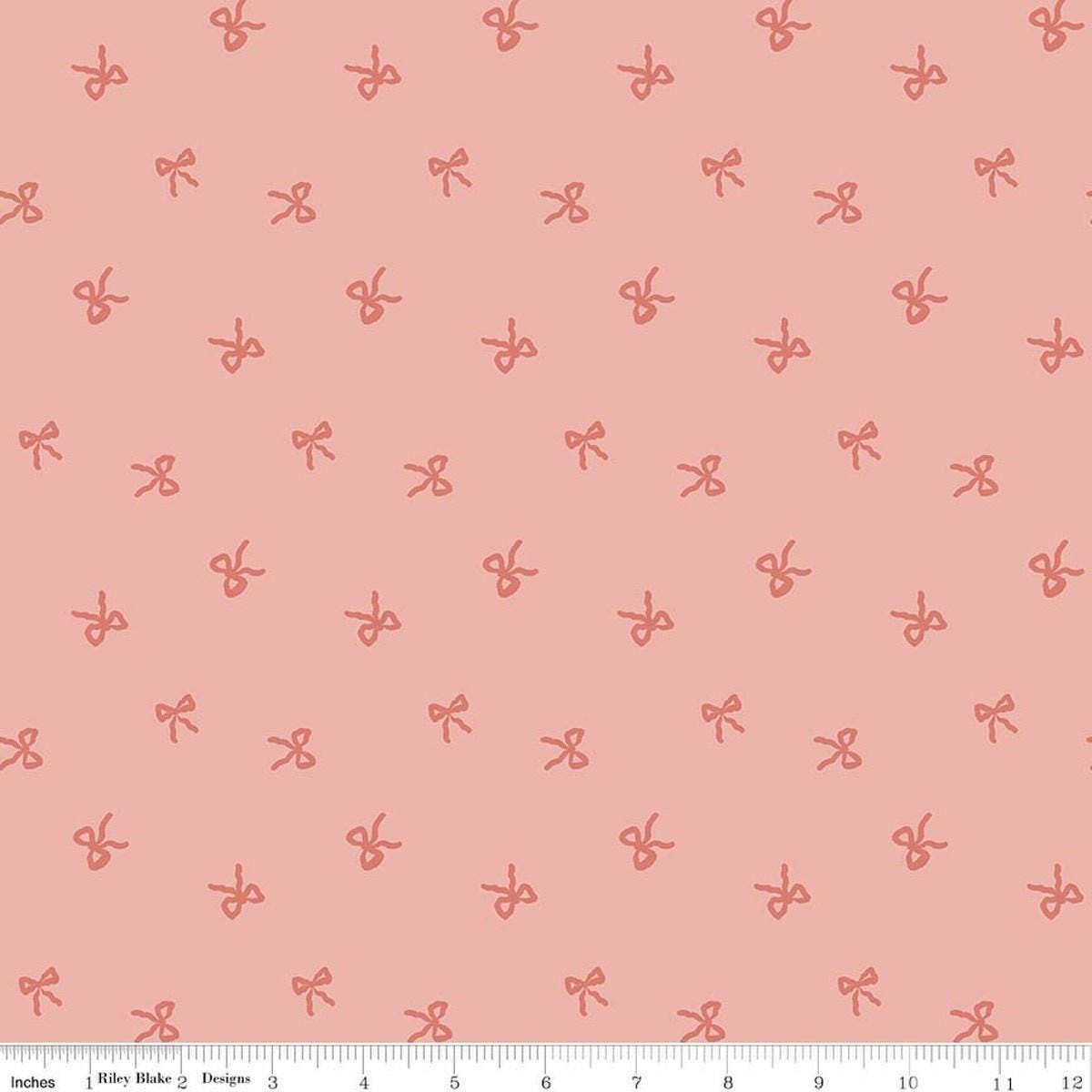 Image of Designer Flannel Sweet Cotton Tales Bows Pink quilting cotton fabric by Little Forest Atelier for RIley Blake Designs. Features bows on a pink background. Cute Little Fabric Shop.