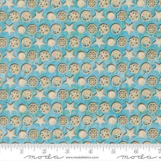 Image of Saltwater The White Pearl Surf quilting cotton fabric by Cathe Holden for Moda Fabrics. Features seashells on a blue background. Cute Little Fabric Shop.