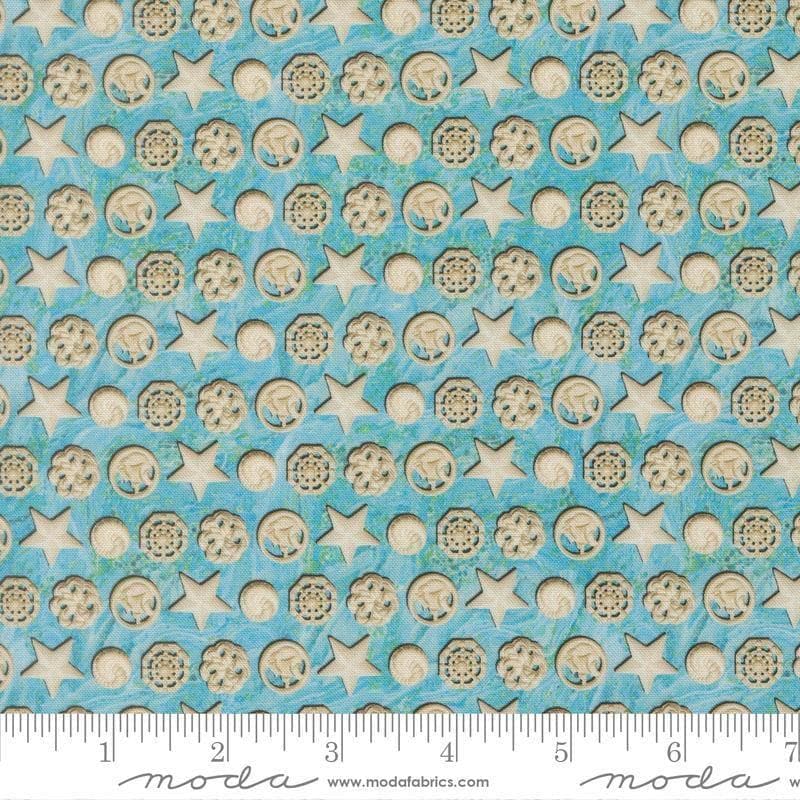 Image of Saltwater The White Pearl Surf quilting cotton fabric by Cathe Holden for Moda Fabrics. Features seashells on a blue background. Cute Little Fabric Shop.