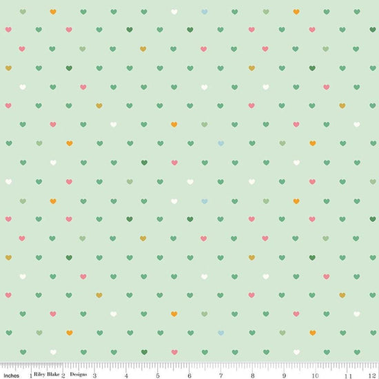 Image of Designer Flannel Meadow Serendipity 2 Hearts Mint flannel cotton fabric by Minki Kim for Riley Blake Designs. Features hearts on a green background. Cute Little Fabric Shop.