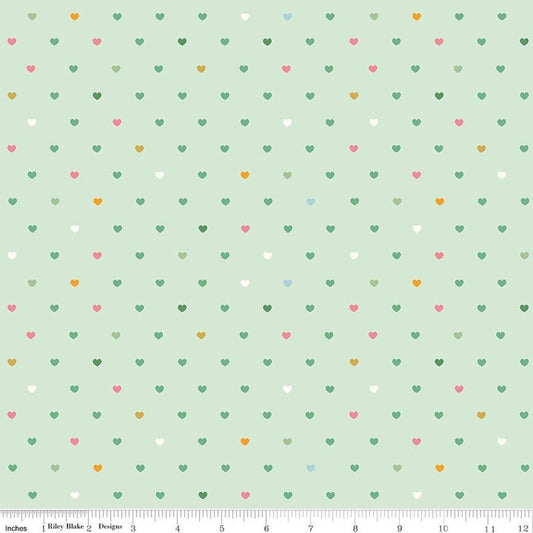 Image of Designer Flannel Meadow Serendipity 2 Hearts Mint flannel cotton fabric by Minki Kim for Riley Blake Designs. Features hearts on a green background. Cute Little Fabric Shop.