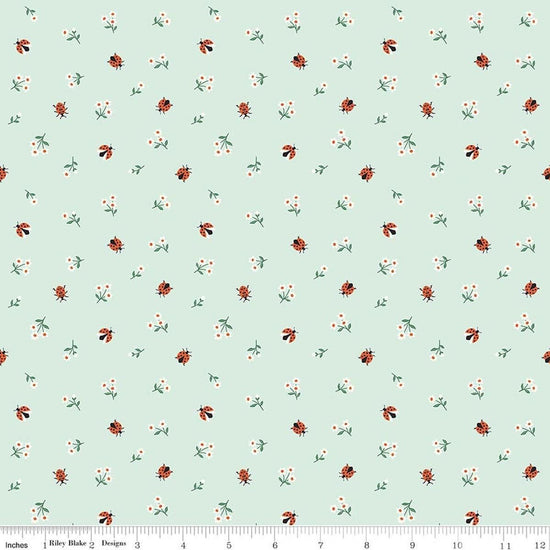 Image of Designer Flannel Meadow Moments Ladybugs Mint flannel cotton fabric by Sandra Nygard-Parthoens for Riley Blake Designs. Features ladybugs and flowers on a green background. Cute Little Fabric Shop.