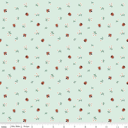 Image of Designer Flannel Meadow Moments Ladybugs Mint flannel cotton fabric by Sandra Nygard-Parthoens for Riley Blake Designs. Features ladybugs and flowers on a green background. Cute Little Fabric Shop.