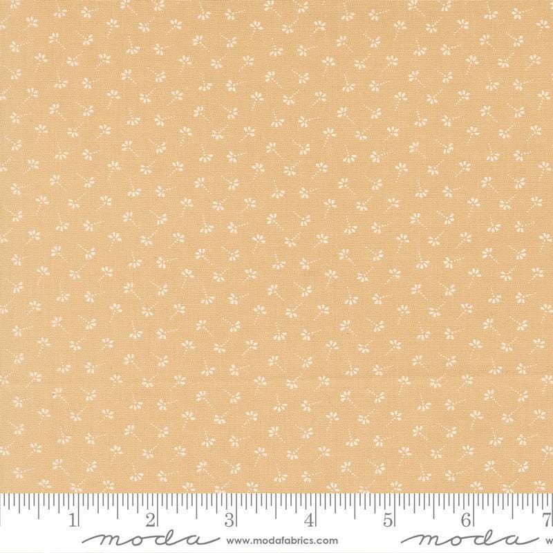 Image of Summers End Dandelion Almond Pie quilting cotton fabric by Fig Tree Co for Moda Fabrics. Features flowers on a tan background. Cute Little Fabric Shop.