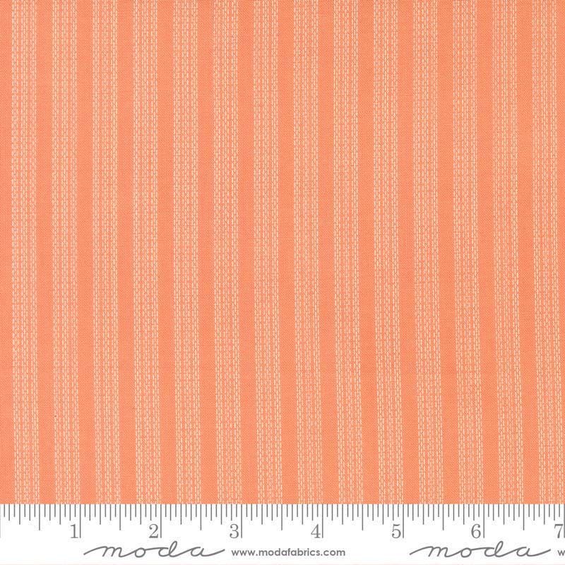 Image of Fruit Salad Stripes Coral quilting cotton fabric by Corey Yoder for Moda Fabrics. Features fruit on an orange background. Cute Little Fabric Shop.