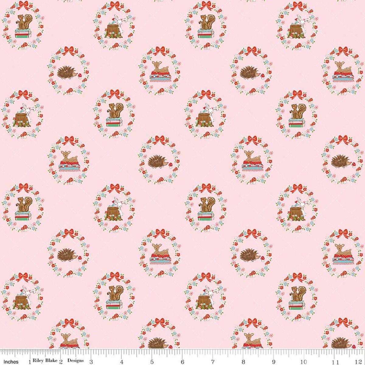 Image of Whimsical Woodland Animals Pink quilting cotton fabric by Tasha Noel for Riley Blake Designs. Features flowers and animals on a pink background. Cute Little Fabric Shop.
