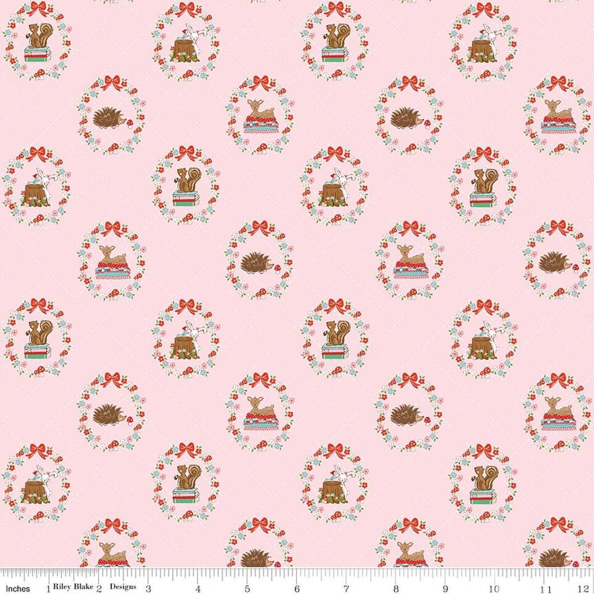 Image of Whimsical Woodland Animals Pink quilting cotton fabric by Tasha Noel for Riley Blake Designs. Features flowers and animals on a pink background. Cute Little Fabric Shop.