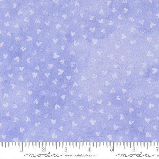 Image of Delphinium Hearts Lilac quilting cotton by Janet Clare for Moda Fabrics. Features hearts on a blue background. Cute Little Fabric Shop.