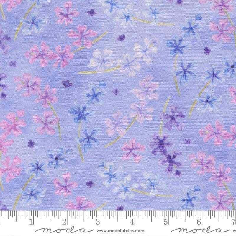 Image of Delphinium Lilacs Bluebell quilting cotton by Janet Clare for Moda Fabrics. Features flowers on a blue background. Cute Little Fabric Shop.
