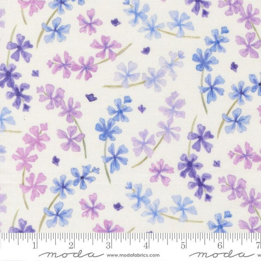 Image of Delphinium Lilacs Snowdrop quilting cotton by Janet Clare for Moda Fabrics. Features flowers on a white background. Cute Little Fabric Shop.