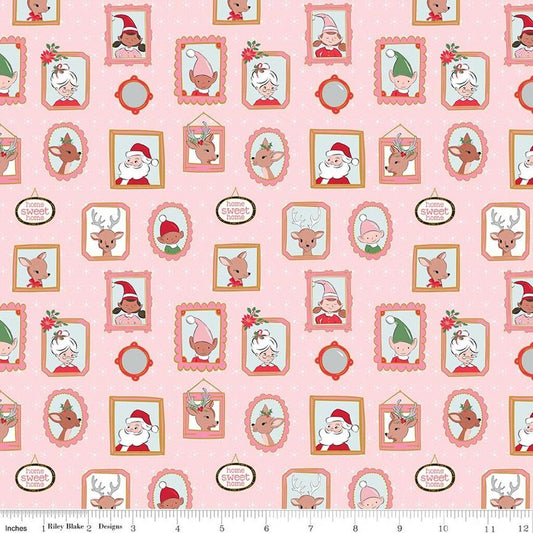 Image of Claus & Co. Wallpaper Pink Sparkle quilting cotton fabric by Melissa Mortenson for Riley Blake Designs. Features pictures on a pink background. Cute Little Fabric Shop.
