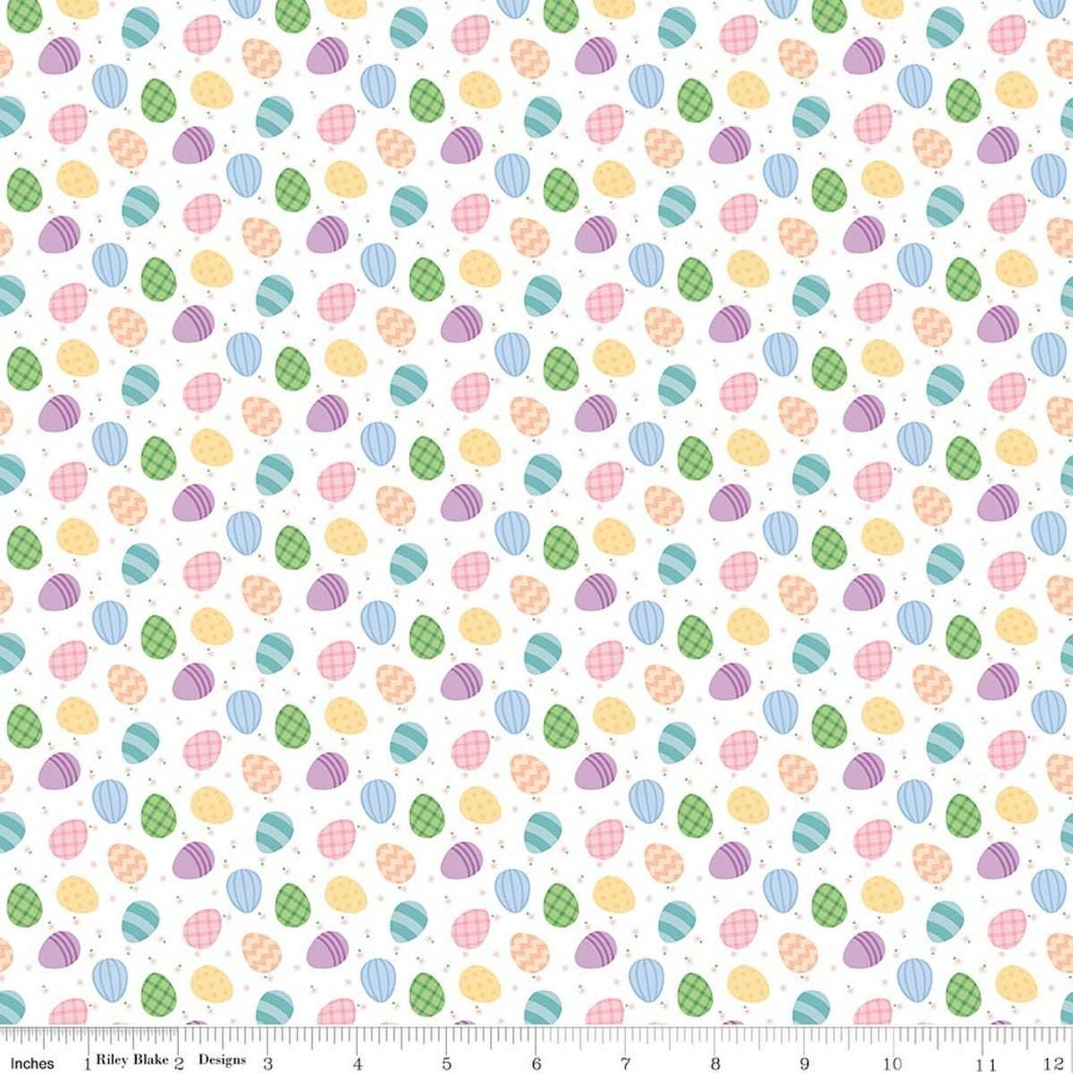 Image of Seasonal Basics Egg Toss White quilting cotton fabric by Christopher Thompson for Riley Blake Designs. Features eggs on a white background. Cute Little Fabric Shop.