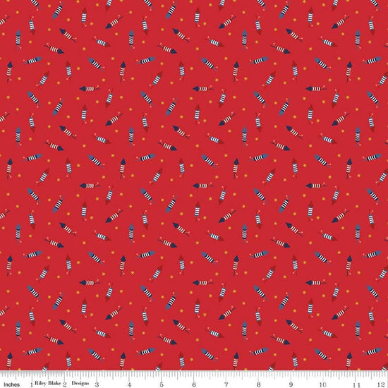 Image of Seasonal Basics Pop Boom Bang Red quilting cotton fabric by Christopher Thompson for Riley Blake Designs. Features fireworks on a red background. Cute Little Fabric Shop.