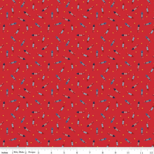 Image of Seasonal Basics Pop Boom Bang Red quilting cotton fabric by Christopher Thompson for Riley Blake Designs. Features fireworks on a red background. Cute Little Fabric Shop.