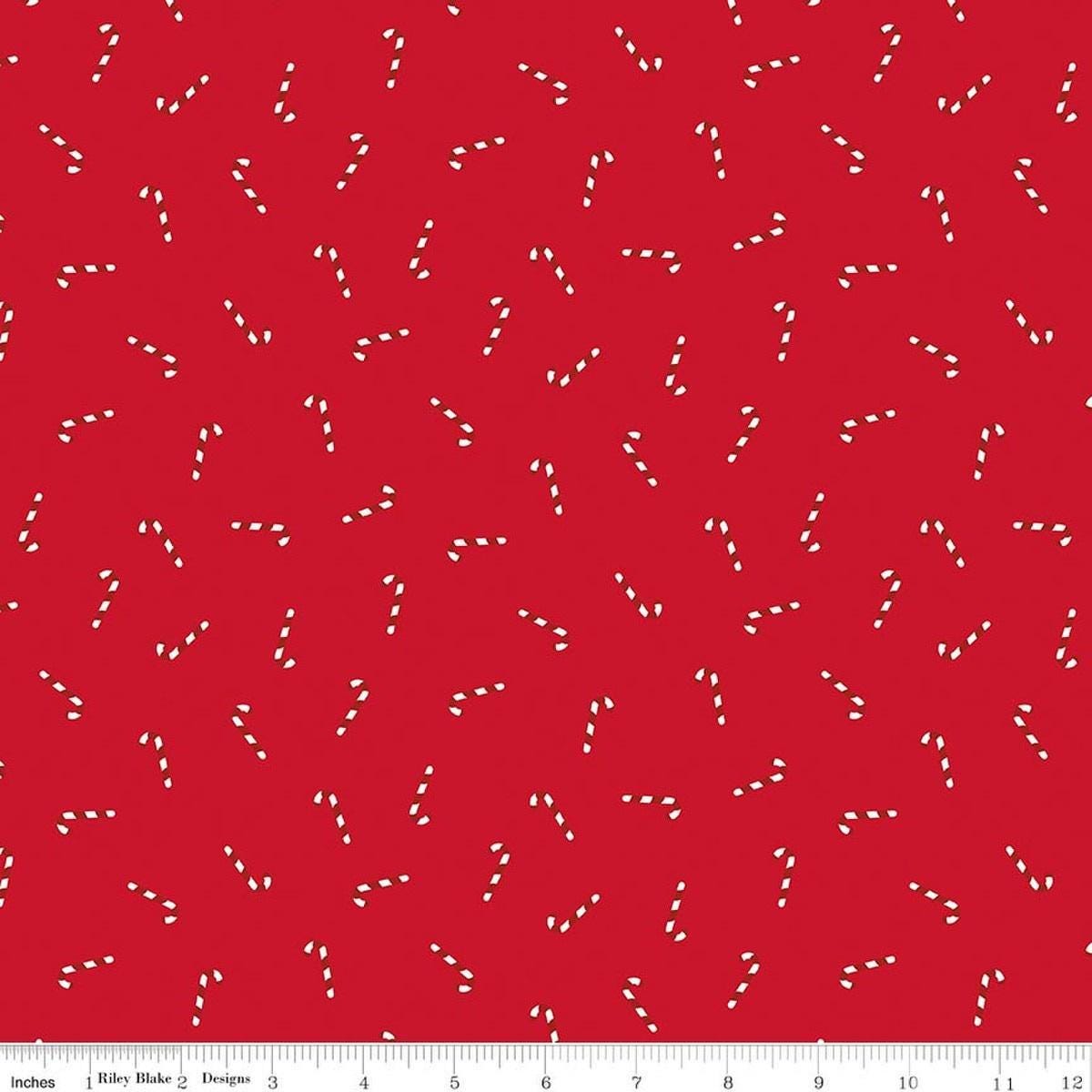 Image of Seasonal Basics Candy Canes Ren quilting cotton fabric by Christopher Thompson for Riley Blake Designs. Features candy canes on a red background. Cute Little Fabric Shop.