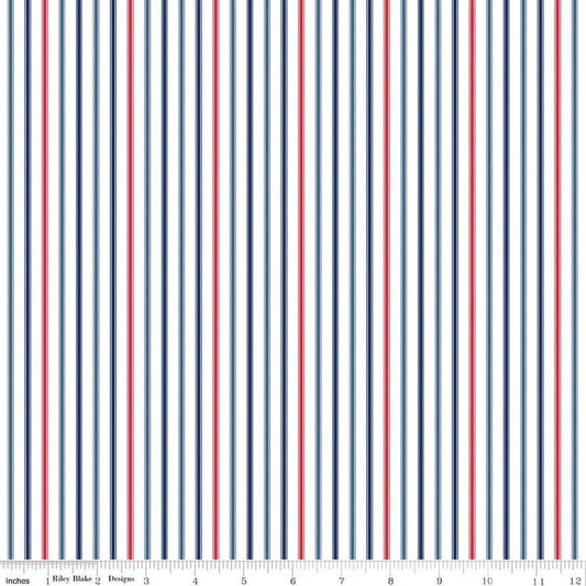 Image of Seasonal Basics Ticking Stripe Patriotic quilting cotton fabric by Christopher Thompson for Riley Blake Designs. Features stripes on a blue background. Cute Little Fabric Shop.