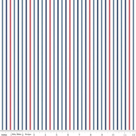 Image of Seasonal Basics Ticking Stripe Patriotic quilting cotton fabric by Christopher Thompson for Riley Blake Designs. Features stripes on a blue background. Cute Little Fabric Shop.