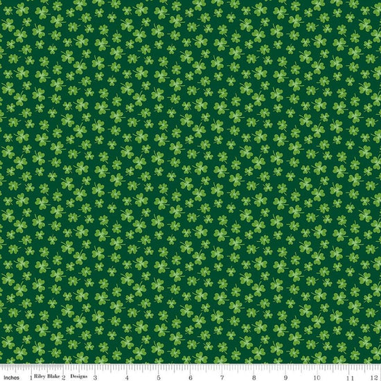 Image of Seasonal Basics Shamrocks Green quilting cotton fabric by Christopher Thompson for Riley Blake Designs. Features clovers on a green background. Cute Little Fabric Shop.