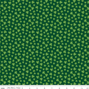 Image of Seasonal Basics Shamrocks Green quilting cotton fabric by Christopher Thompson for Riley Blake Designs. Features clovers on a green background. Cute Little Fabric Shop.
