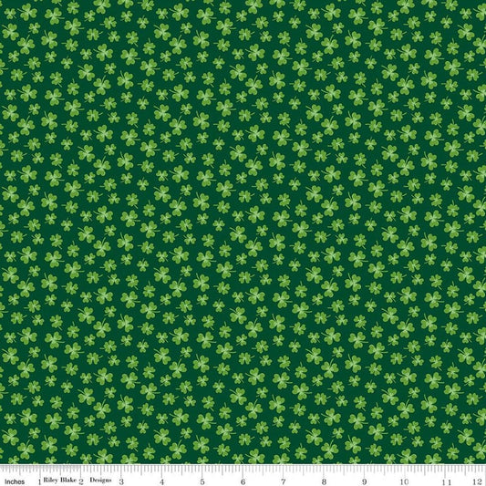 Image of Seasonal Basics Shamrocks Green quilting cotton fabric by Christopher Thompson for Riley Blake Designs. Features clovers on a green background. Cute Little Fabric Shop.