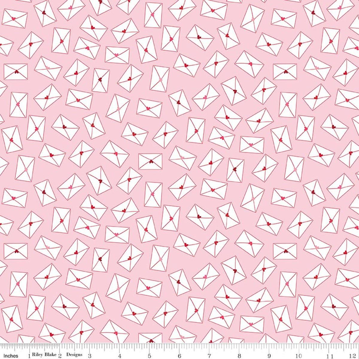 Image of Seasonal Basics Love Notes Pink quilting cotton fabric by Christopher Thompson for Riley Blake Designs. Features envelopes on a pink background. Cute Little Fabric Shop.
