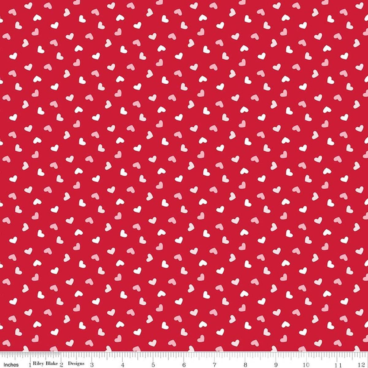 Image of Seasonal Basics Heart Toss Red quilting cotton fabric by Christopher Thompson for Riley Blake Designs. Features hearts on a red background. Cute Little Fabric Shop.