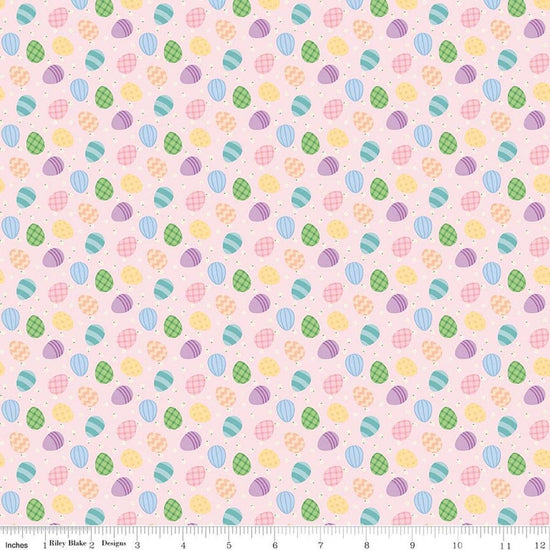 Image of Seasonal Basics Egg Toss Pink quilting cotton fabric by Christopher Thompson for Riley Blake Designs. Features eggs on a pink background. Cute Little Fabric Shop.