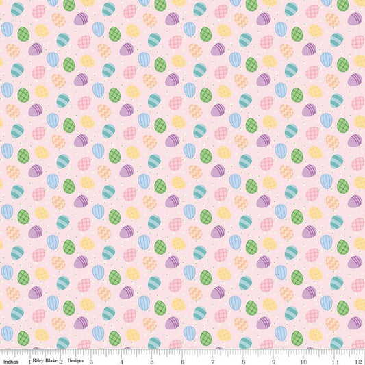 Image of Seasonal Basics Egg Toss Pink quilting cotton fabric by Christopher Thompson for Riley Blake Designs. Features eggs on a pink background. Cute Little Fabric Shop.
