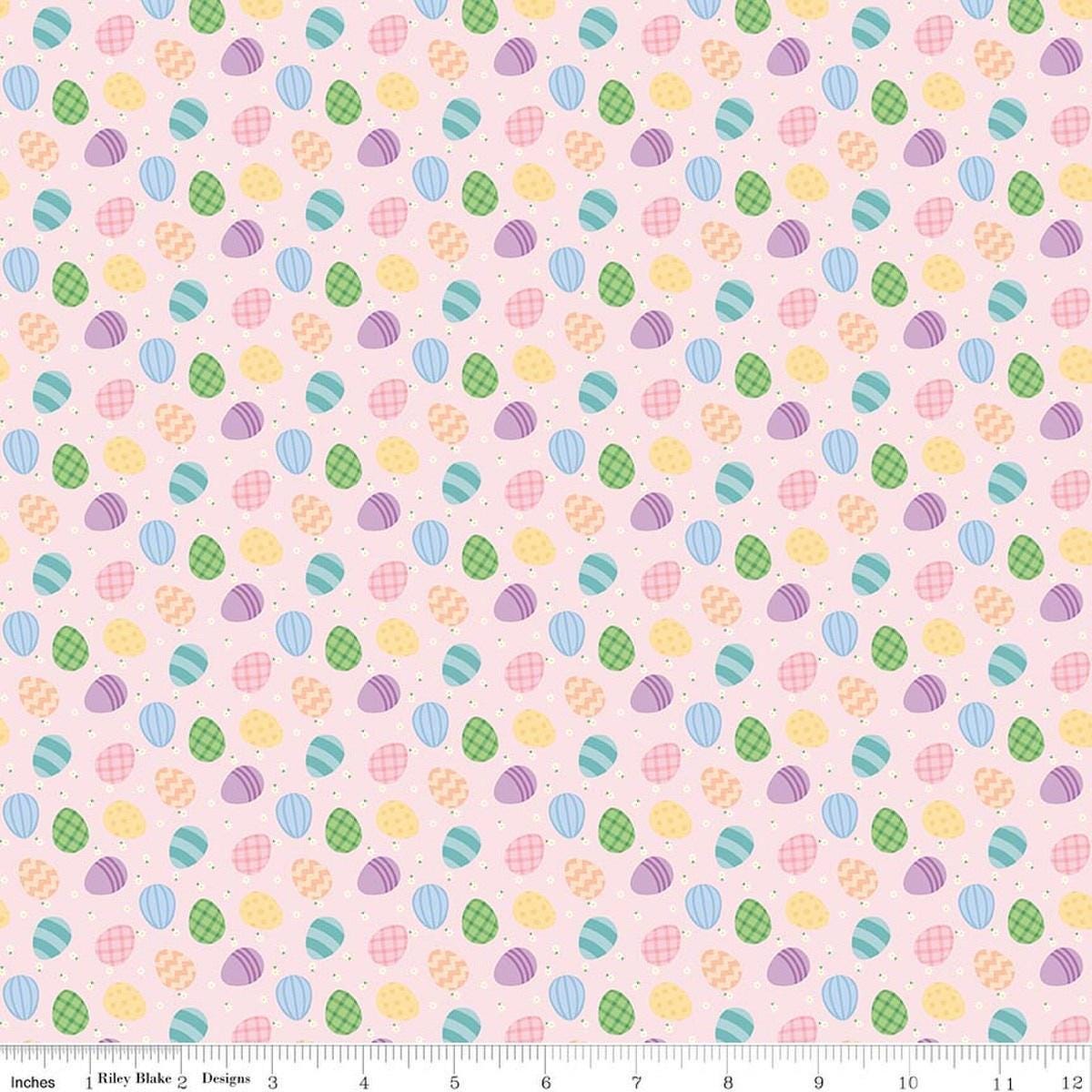 Image of Seasonal Basics Egg Toss Pink quilting cotton fabric by Christopher Thompson for Riley Blake Designs. Features eggs on a pink background. Cute Little Fabric Shop.