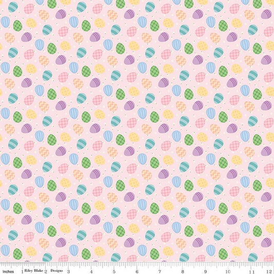 Image of Seasonal Basics Egg Toss Pink quilting cotton fabric by Christopher Thompson for Riley Blake Designs. Features eggs on a pink background. Cute Little Fabric Shop.