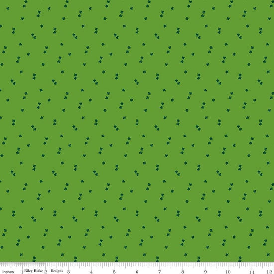 Image of Seasonal Basics Clovers Holly quilting cotton fabric by Christopher Thompson for Riley Blake Designs. Features clovers on a green background. Cute Little Fabric Shop.