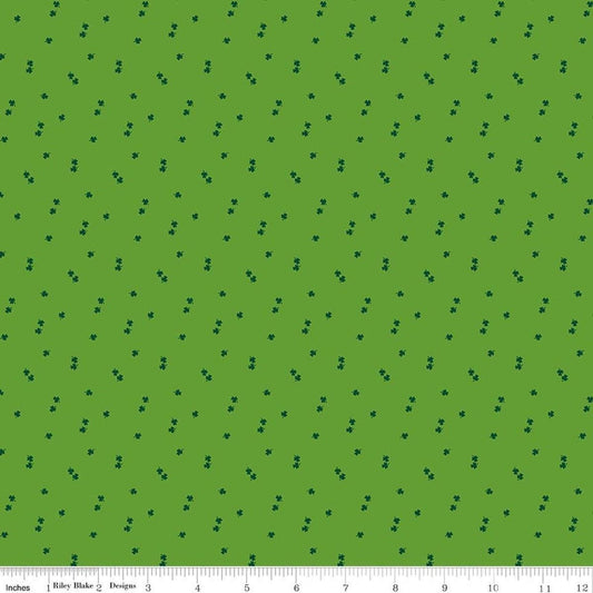Image of Seasonal Basics Clovers Holly quilting cotton fabric by Christopher Thompson for Riley Blake Designs. Features clovers on a green background. Cute Little Fabric Shop.