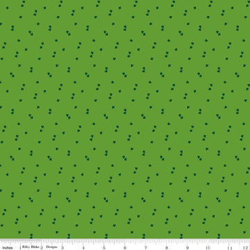 Image of Seasonal Basics Clovers Holly quilting cotton fabric by Christopher Thompson for Riley Blake Designs. Features clovers on a green background. Cute Little Fabric Shop.