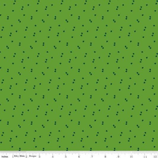 Image of Seasonal Basics Clovers Holly quilting cotton fabric by Christopher Thompson for Riley Blake Designs. Features clovers on a green background. Cute Little Fabric Shop.