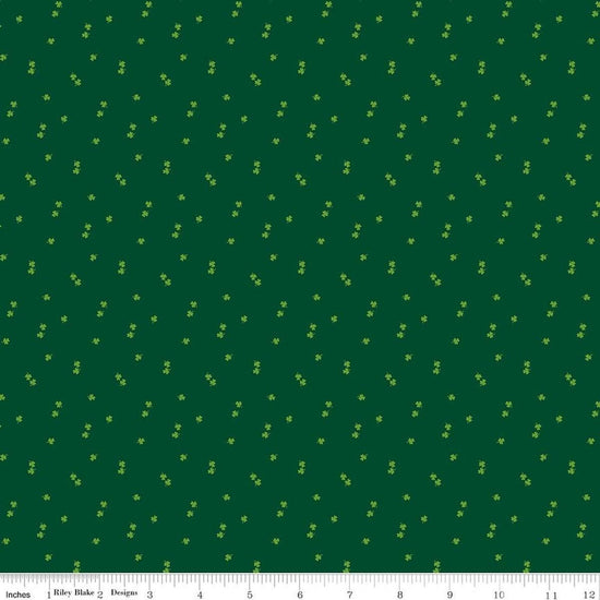 Image of Seasonal Basics Clovers Green quilting cotton fabric by Christopher Thompson for Riley Blake Designs. Features clovers on a green background. Cute Little Fabric Shop.