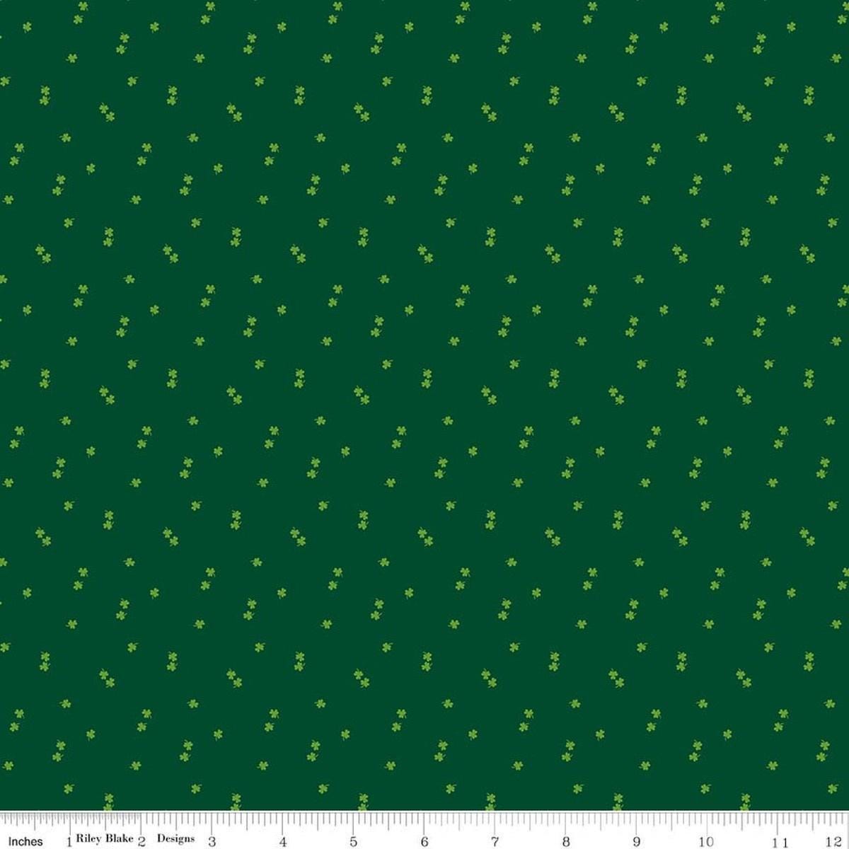 Image of Seasonal Basics Clovers Green quilting cotton fabric by Christopher Thompson for Riley Blake Designs. Features clovers on a green background. Cute Little Fabric Shop.